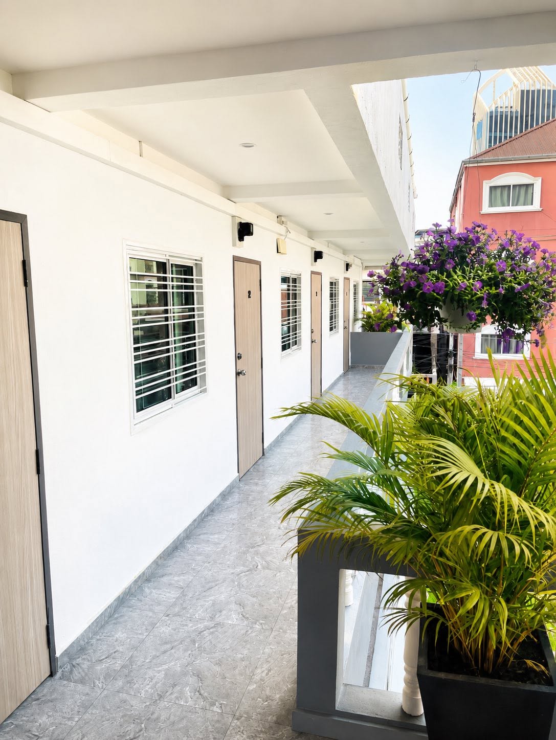 Upper floor corridor with flowers and plants
